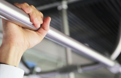 Hand on metro rail 