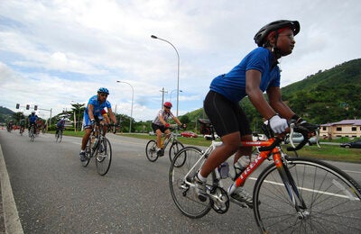 People riding bicycles on a road