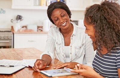 mother and girl doing homework