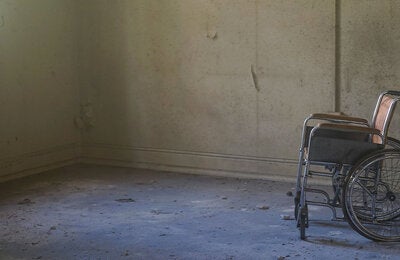 Abandoned wheelchair in hospital room