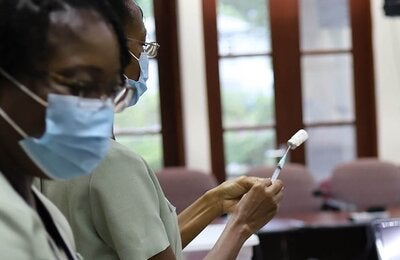 Nurse preparing influenza vaccine