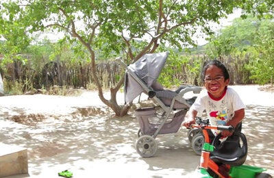 Happy child playing in courtyard
