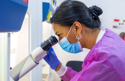 Woman using a microscope