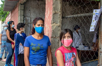 People walking wearing masks