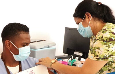 Man receives COVID-19 vaccination