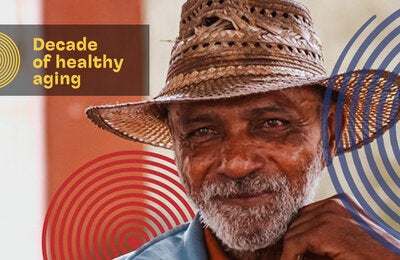 Smiling older adult wearing hat