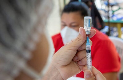 Woman is being vaccinated against COVID-19