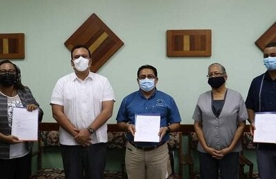 Signing of Mental Health and Psychosocial Consultancy Agreement in Belize. Photo Courtesy of Government Press Office of Belize