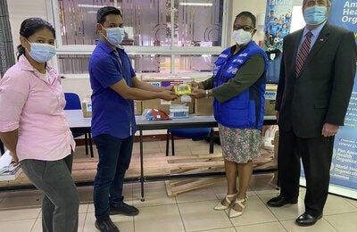 Cold Chain Coordinator Celine Karijo, Drs. Djamiel Koesni- EPI Manager BOG, PAHO Representative Dr. Karen Lewis-Bell, and USA Deputy Chief of Mission Michael Keays