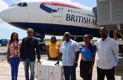 Bahamian Prime Minister Hon. Phillip Davis, Minister of Health and Wellness Dr. Michael Darville, PAHO/WHO BHS Country Representative, Dr. Eldonna Boisson and other government officials receive the first pediatric COVID-19 vaccines. 
