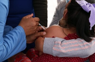 A girl receives a vaccine