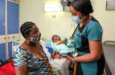 Mother with child at health care setting