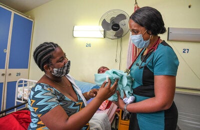 Mother with child receiving medical care