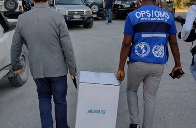 man carries box with supplies