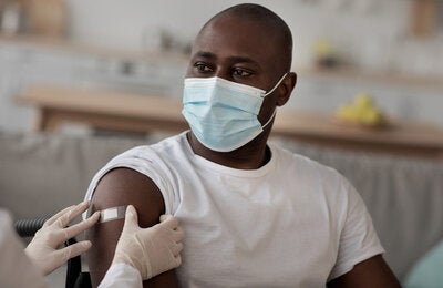 Wheel chair bound person receives vaccine