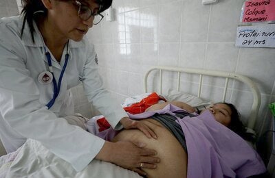 Pregnant woman receiving medical attention