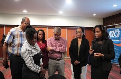 PAHO/WHO Suriname Technical Officer Dr. Wendy Emanuelson-Telgt engaging with several participants during the 2-day workshop