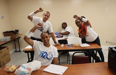 PAHO/WHO team posing with bandages they created.