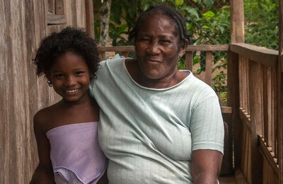 Woman embracing girl