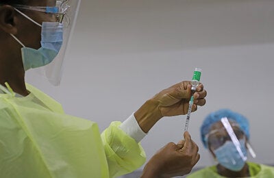 Nurse preparing a vaccine for use