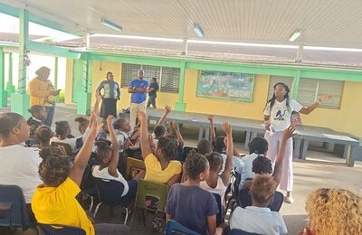 Students answering questions during World Obesity Day observance