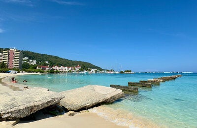 Beautiful blue ocean and white sand Jamaican beach.