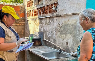 Health worker support  community by eliminating mosquito breeding grounds