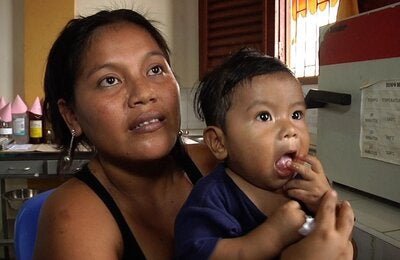 woman with toddler on her lap