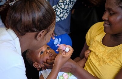 Child receives polio vaccine