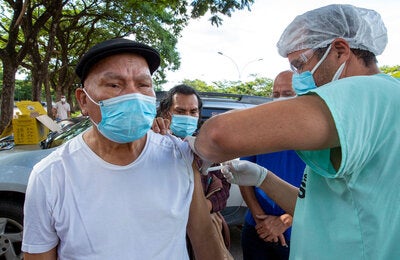 Older person receiving vaccine