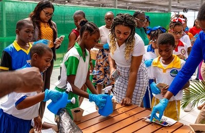 President of CHARGE, Kezia St Brice-Isidore, interacting with some of the young people.
