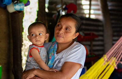 Mother holding child in arms