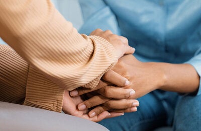 Holding hands as a gesture of support