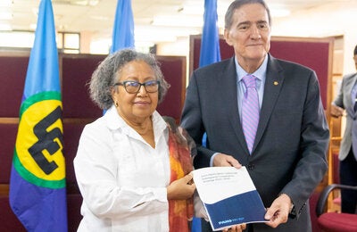 Dr. Carla N. Barbett, Secretary-General of CARICOM and Dr. Jarbas Barbosa pose after signing the agreement.