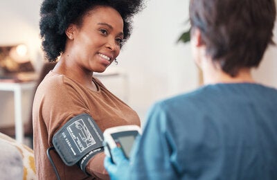 Woman having her blood pressure checked