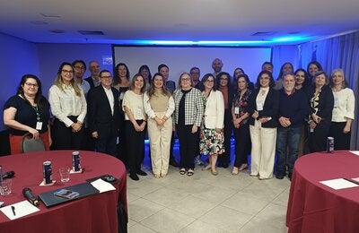 Participants of the PAHO inter-programmatic meeting in São Paulo, held in August 2025, pose together in a conference setting. The meeting brought together specialists from Latin American countries and technical teams from BIREME, PAHO Brazil, and PAHO/WHO headquarters to discuss guidelines on the integrated surveillance of vertical transmission of the Oropouche virus.