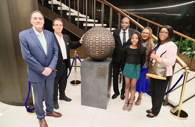 Dr. Barbosa, artist and family members of Dr. Etienne