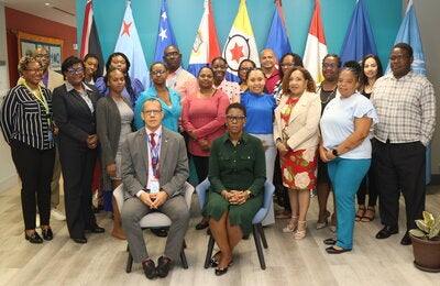 PAHO Assistant Director, Dr. Rhonda Sealey-Thomas,  with the PAHO/WHO Trinidad and Tobago Country Office team