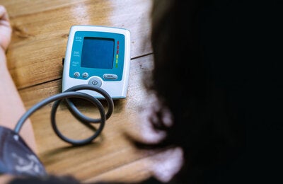 Woman checking her blood pressure