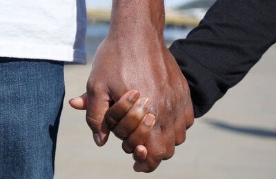 a couple holds hands