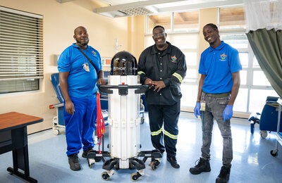 McPhee team members and Robot