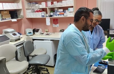 A lab technician and Professor Christine Carrington, Professor of Molecular Genetics and Virology in the lab at the UWI.