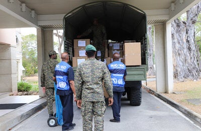 PAHO and Barbados Defence Force personnel loading truck with donated items