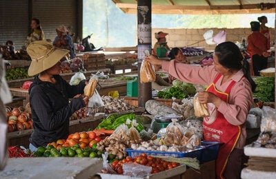 Women interacting in an open market