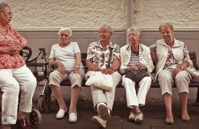 older adults sitting and smiling