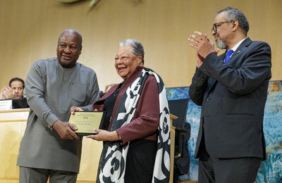Dr Merceline Dahl-Regis receiving her award from President of the Republic of Ghana H.E. John Dramani Mahama and WHO Director-General Dr Tedros Adhanom Ghebreyesus.