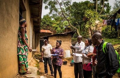 World Bank Group/ V.Tremeau Community representatives come to visit a family in the outskirts of Beni to raise awareness about Ebola.