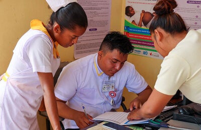 Nurses gather in hospital setting