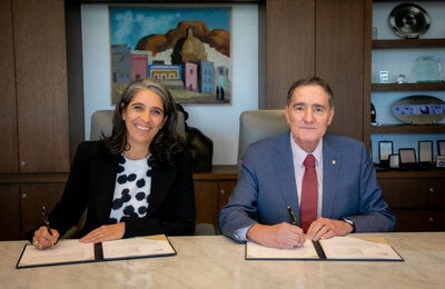Dr. Jarbas Barbosa and Céline Giustihas, during the signing ceremony