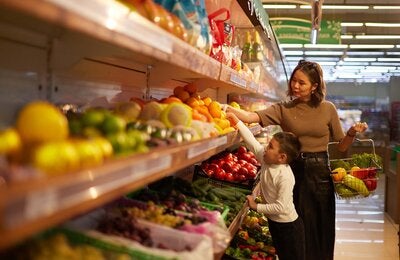 Mother with child shops in a super market
